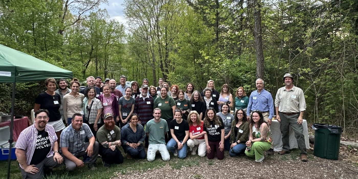 WCC staff, Board Members, and volunteers gather for our summer campfire celebration.